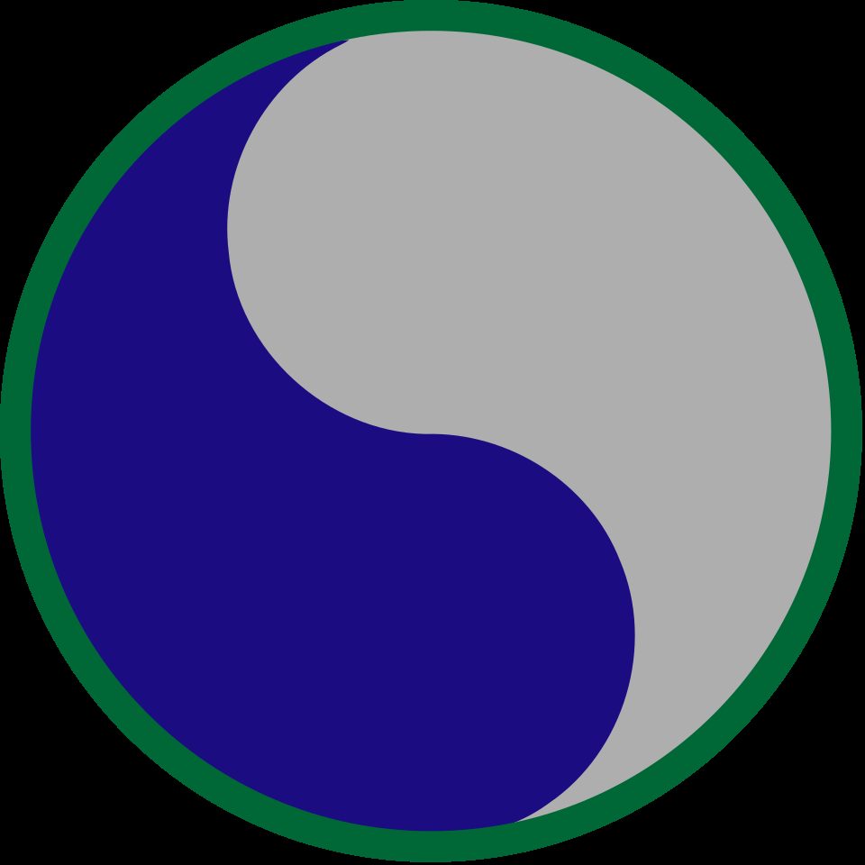 29th US Army Infantry Division shoulder sleeve insignia.Upon a disc with a ⅛ inch (.32 cm) green border 2½ inches (6.35 cm) in diameter over