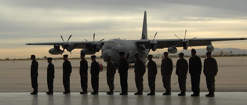First combat-ready HC-130J arrives at Davis-Monthan Air Force Base: The crew of the HC-130J stands at attention in front of their plane on D