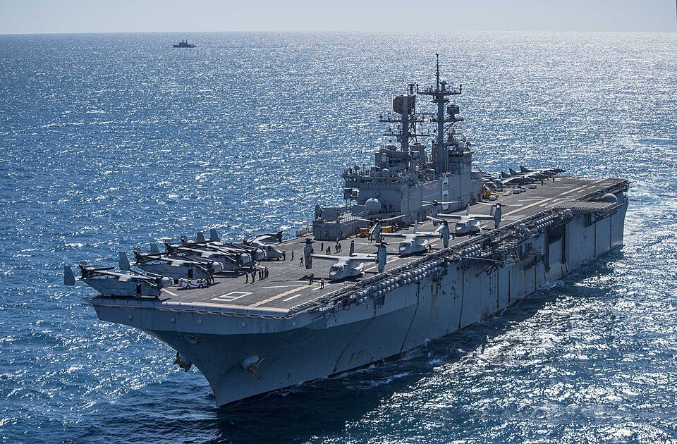 CORAL SEA (Aug. 8, 2017) The amphibious assault ship USS Bonhomme Richard (LHD 6) transits near the Royal Australian Navy hydrographic ship 