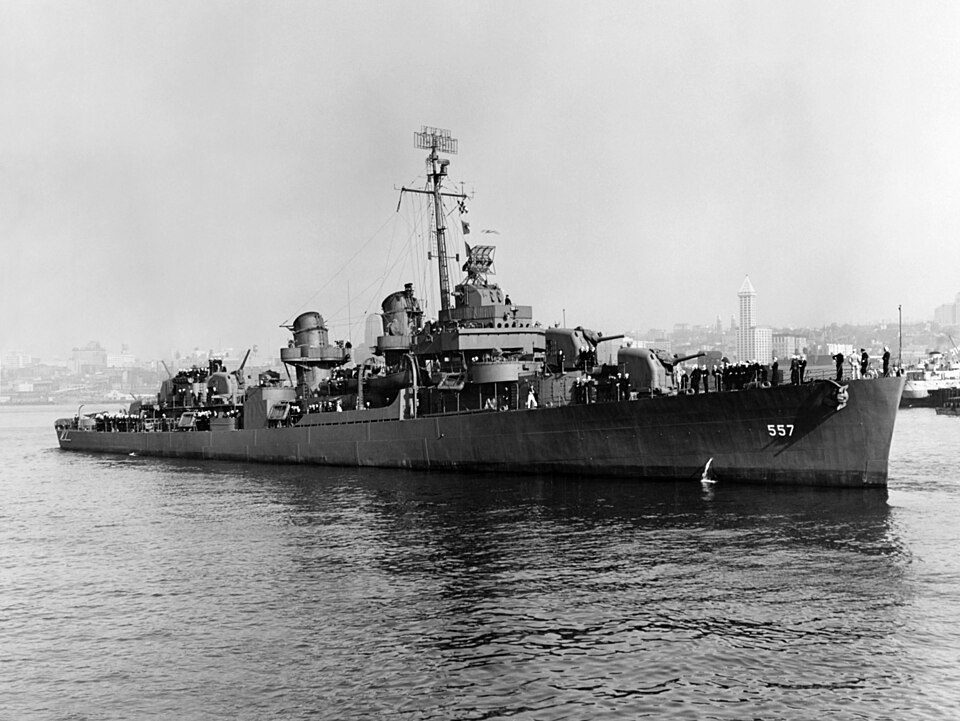 The U.S. Navy destroyer USS Johnston (DD-557) off Seattle, Washington (USA), on 27 October 1943. Smith Tower is in the background over the b